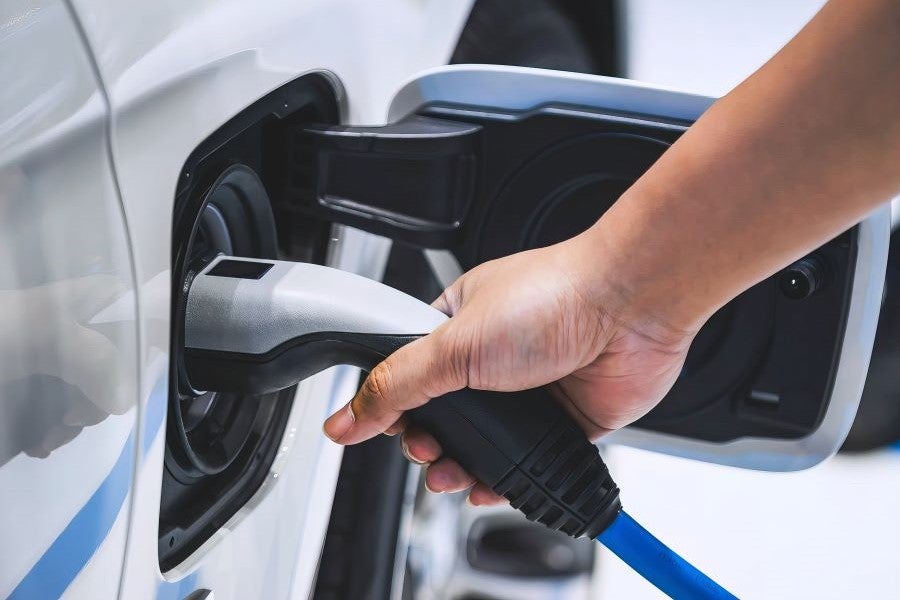 Someone at the charging stating charging their Chevrolet EV vehicle